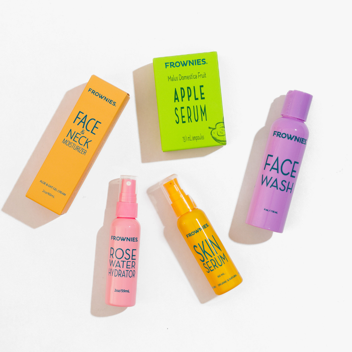 Frownies skincare products including a face wash, serum, and moisturizer on a white background