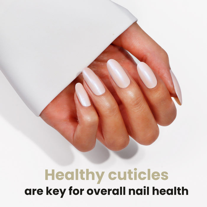 A hand with manicured nails and healthy cuticles is shown. Text reads: "Healthy cuticles matterβadd LONDONTOWN Mini Nourishing Cuticle Oil to your travel essentials for better nail health.