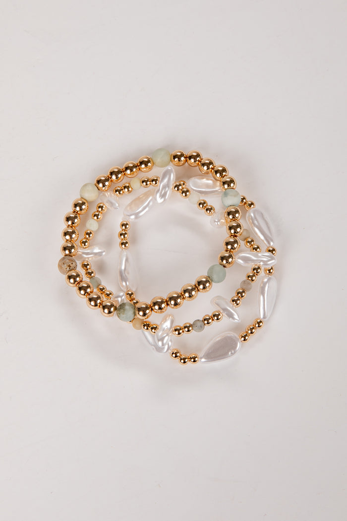 Set of beaded bracelets on a light background