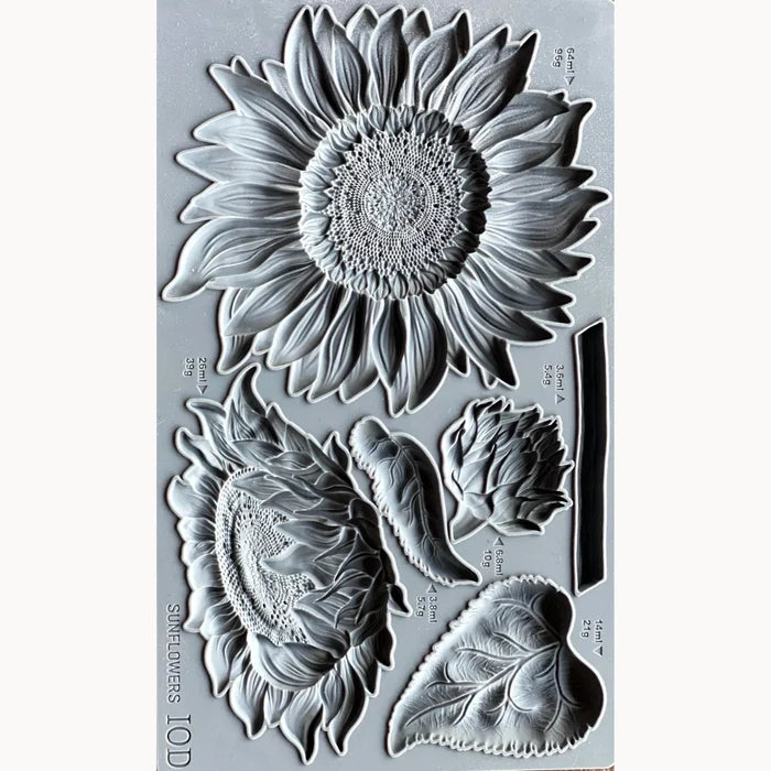 Clear stamp set with sunflower and leaf designs on a gray background