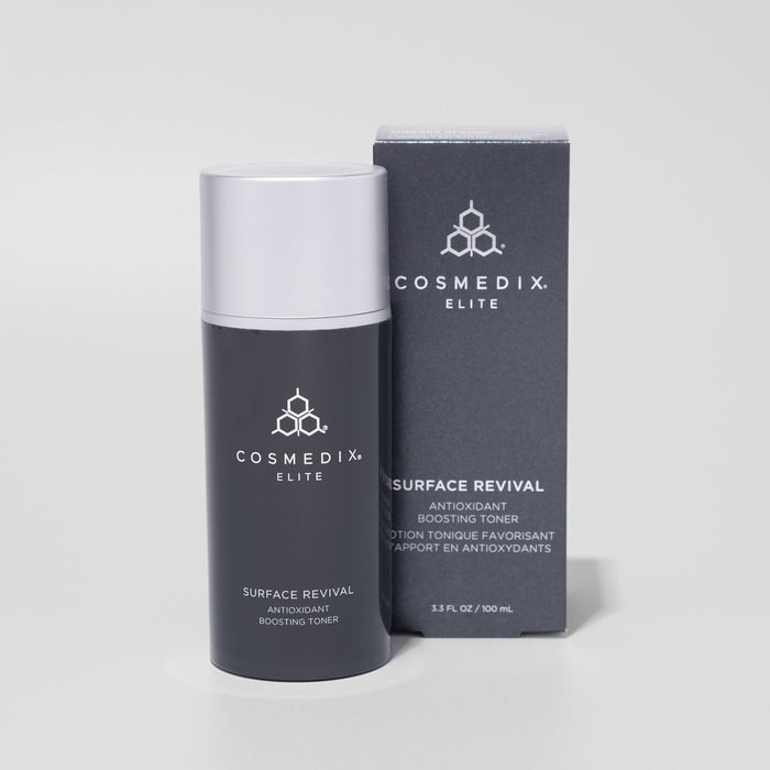 CosMedix Elite Surface Revival bottle with a silver pump cap beside its dark box