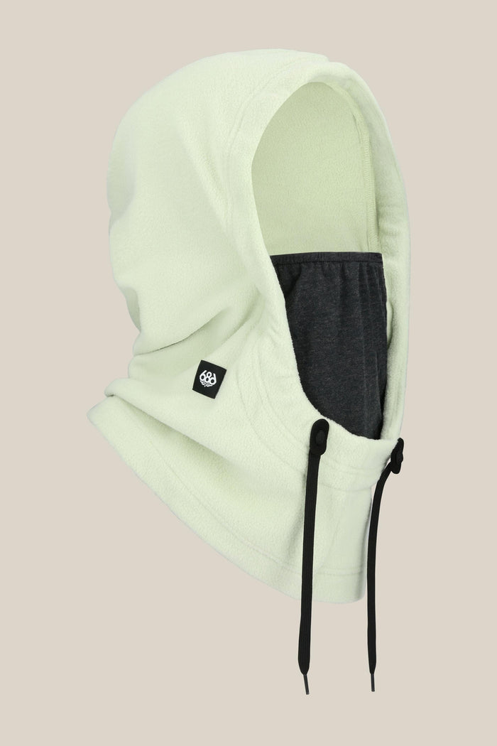 The 686 Tarmac Fleece Hood by 686 features a light green fleece, dark gray inner face covering, black drawstrings, and a small black logo tag‚Äîideal for pairing with winter gear‚Äîdisplayed on a plain beige background.