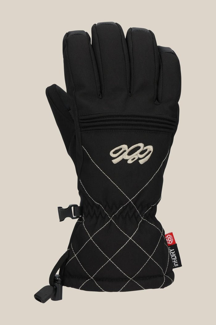 The 686 Women's Jubilee™ Glove is a black winter glove featuring white diamond stitching, an embroidered 686 logo, an adjustable wrist strap with clip, and a red and gray side tag.