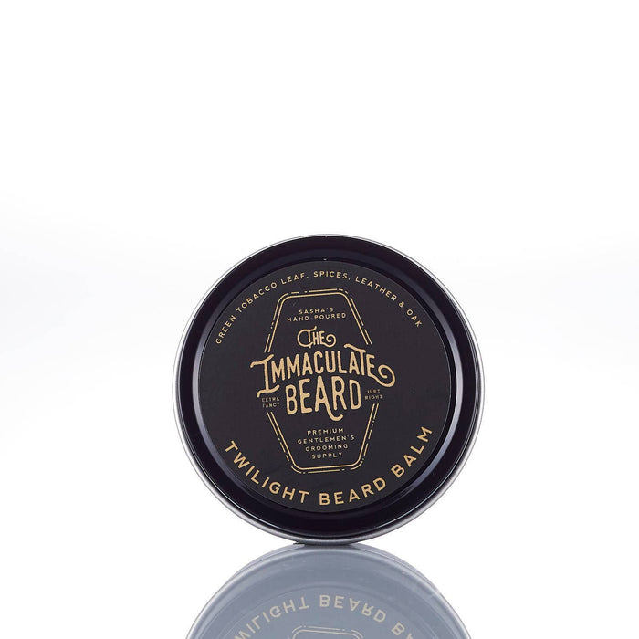 The Immaculate Beard Twilight Beard Oil bottle with a dark label and dropper cap, set against a rustic wooden background.
