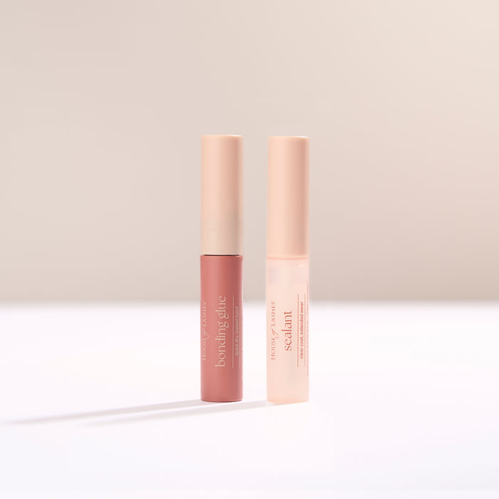 Bond and Seal Set shown with two pink tubes standing upright on a pale surface