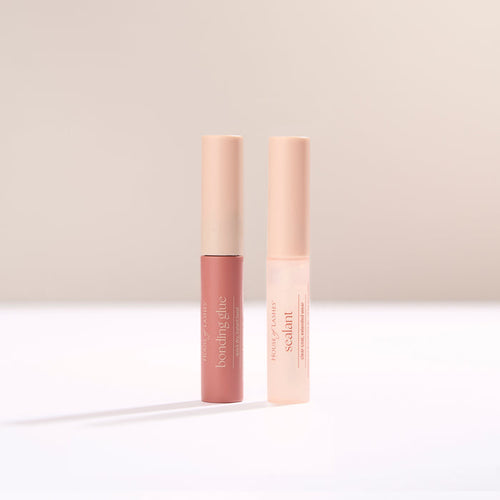 Bond and Seal Set shown with two pink tubes standing upright on a pale surface