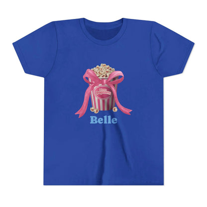 Blue t-shirt with popcorn bucket graphic tied with pink ribbon and text 'Belle'