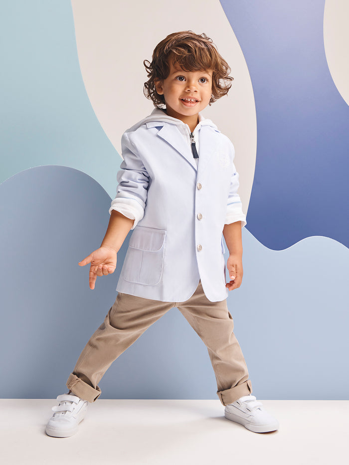 DL1961 boys' Brady Slim pants in khaki 'Birch' on smiling child model with blue blazer, front view.