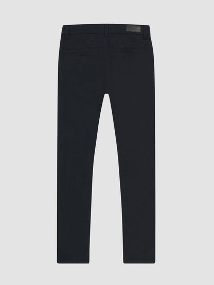 DL1961 boys' Brady Slim chino pants in dark navy 'Depths', flat back view with welt pockets.