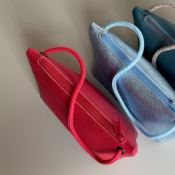 Two cord pouches, red and teal-blue, with braided handles and zipper closures.