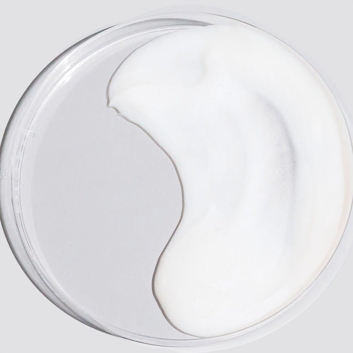 Close-up of white cream in a glass jar from Liquid Crystal Hydration Duo