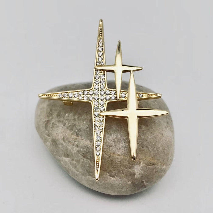 Mio Queena cubic zirconia star brooch pin with sparkling star-shaped design on a white background.
