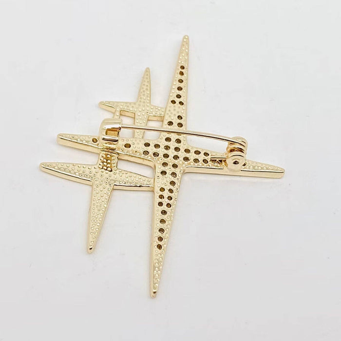 Mio Queena cubic zirconia star brooch pin with sparkling stones on a silver-tone metal backing