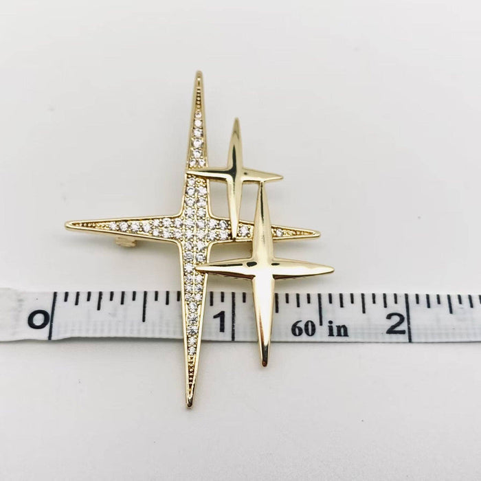 Mio Queena cubic zirconia star brooch pin with sparkling star design and silver-tone metal finish.