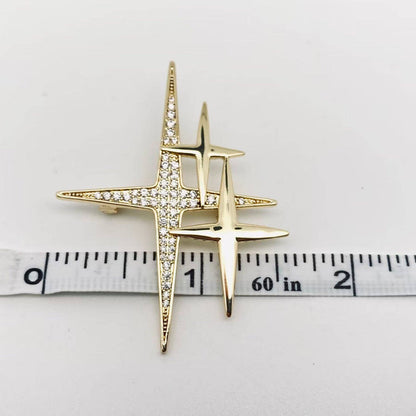 Mio Queena cubic zirconia star brooch pin with sparkling star design and silver-tone metal finish.