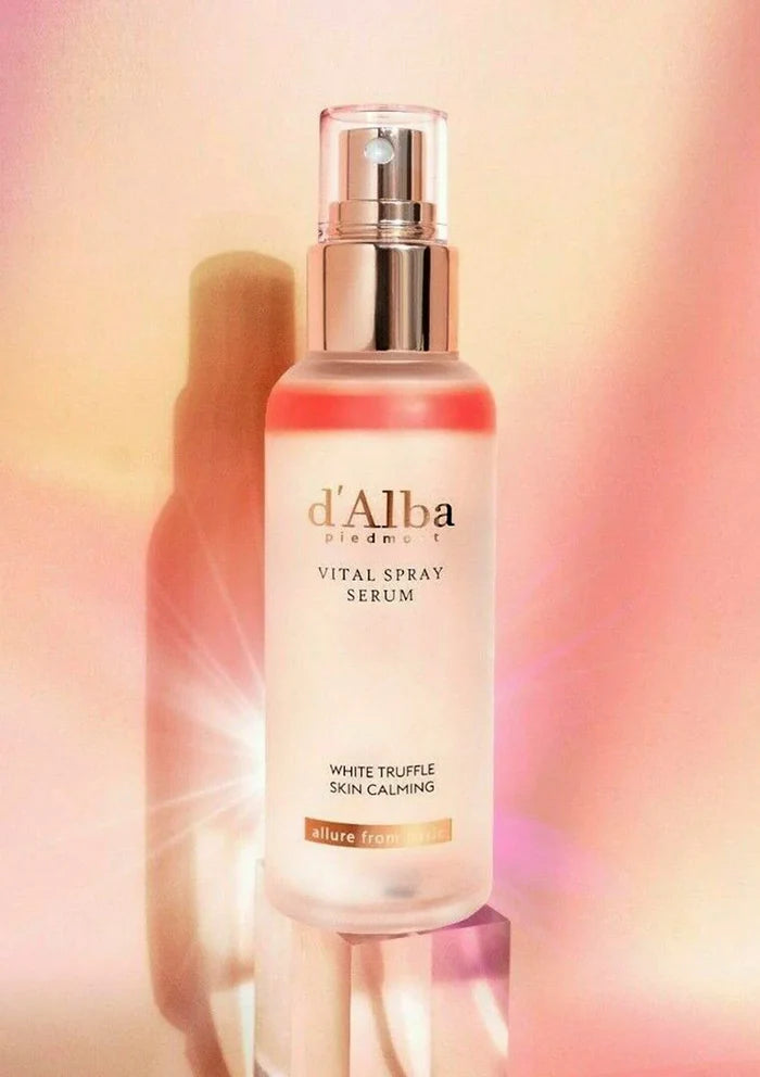 d'Alba vital spray serum bottle on a blurred background