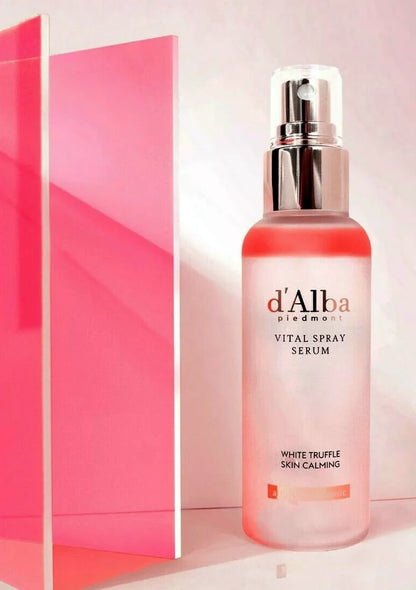 d'Alba vital spray serum bottle on a pink background