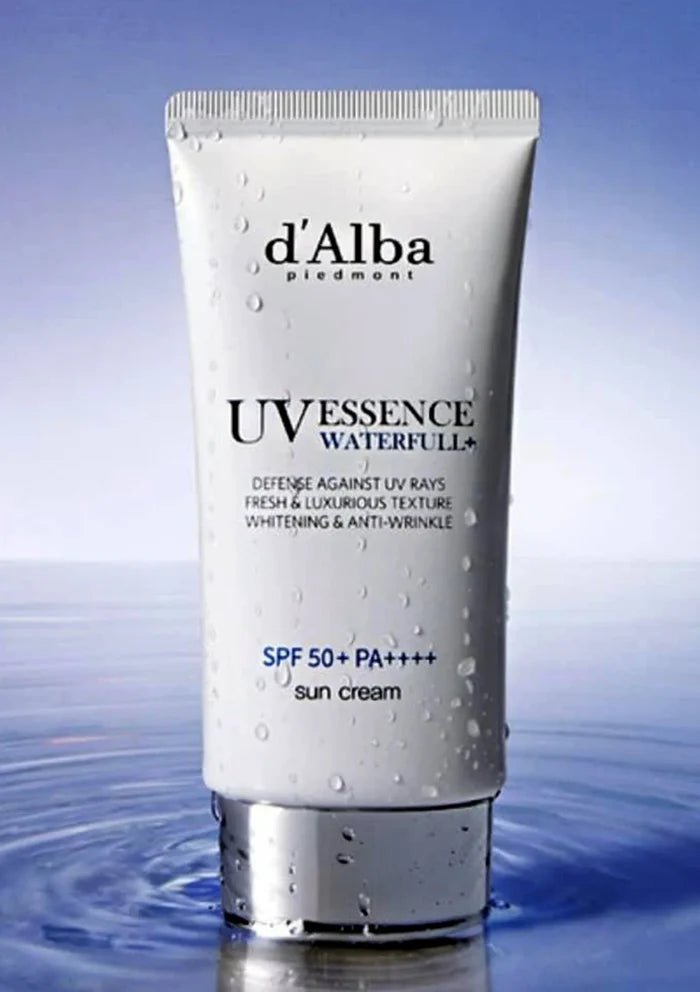 Tube of d'Alba UV Essence Waterful sun cream on a blue water background