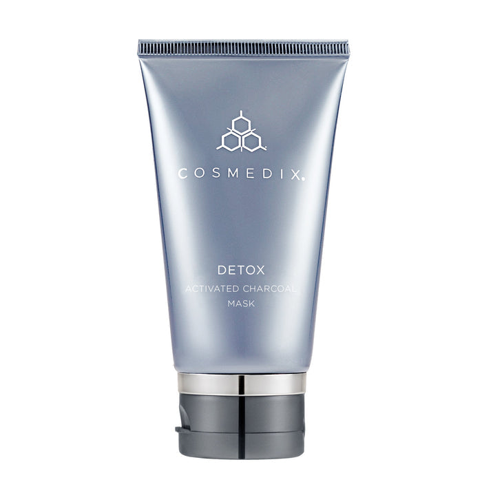Close-up of Detox Activated Charcoal Mask tube top and ridged cap against a white background
