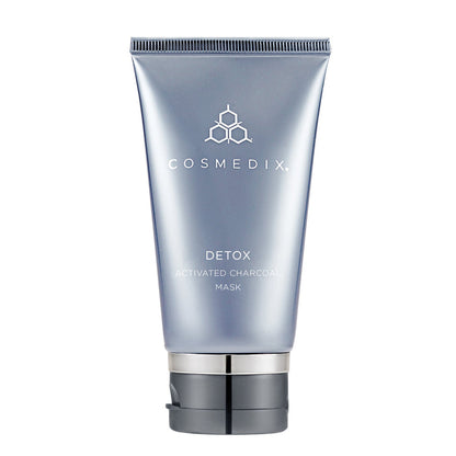 Close-up of Detox Activated Charcoal Mask tube top and ridged cap against a white background