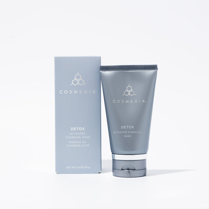 Cosmedix Detox Activated Charcoal Mask packaging with a tube beside it on a white background