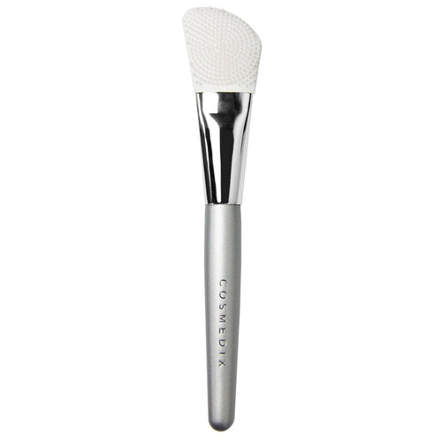 Dual-Sided Silicone Mask Applicator with textured and smooth head and curved silver handle.
