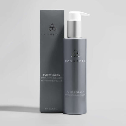 Cosmedix Purity Clean Exfoliating Cleanser bottle and packaging on a light gray background