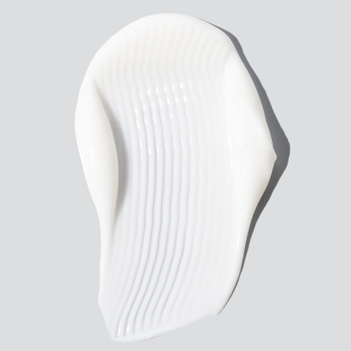 Harmonize moisturizer white lotion swatch closeup against white background