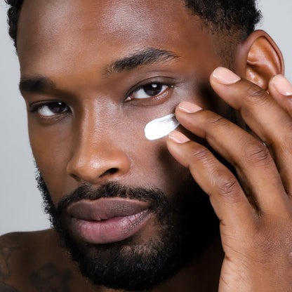 Man applying Eye Genius Brilliant Eye Complex application on their under eyes