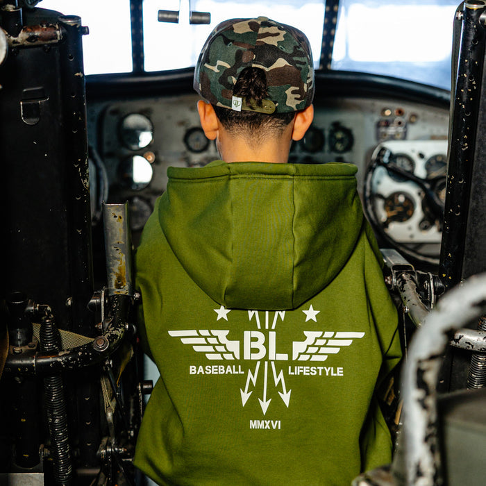 Youth model wearing green Flight Deck Army Green youth hoodie