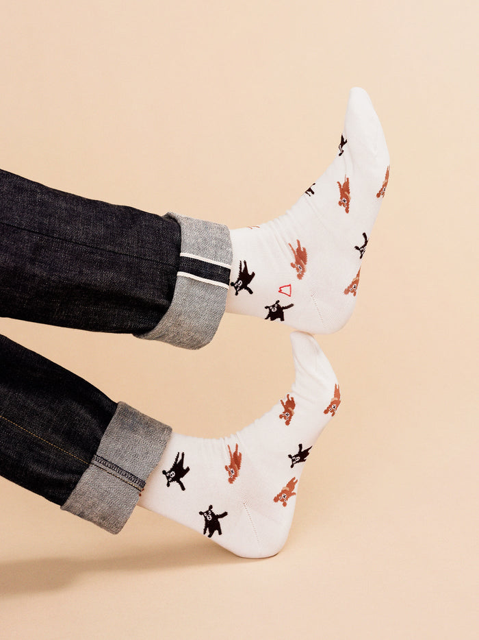 Ivory crew socks on jeans cuffs, scattered bear and black dog print pattern