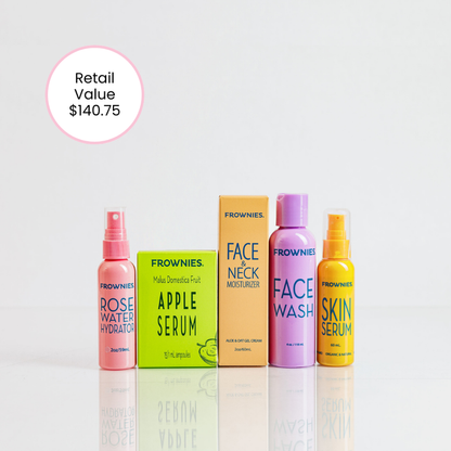 Frownies skincare product set including bottles and a box on a light gray background