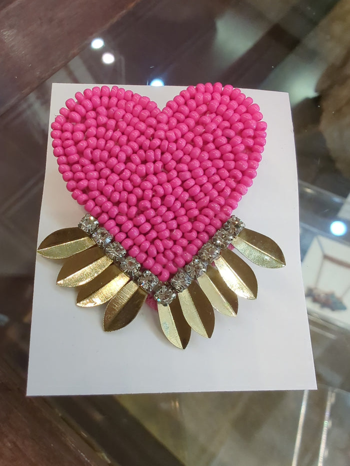 Colorful beaded pins from Camel Threads featuring fun, vibrant designs, perfect for accessorizing clothing or bags.