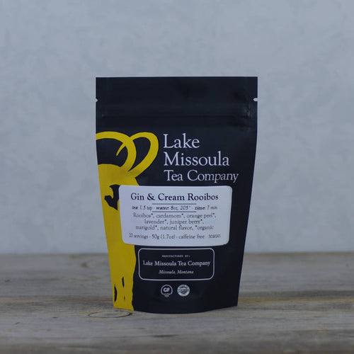 Lake Missoula Tea Company Gin & Cream flavored tea in a tea bag with packaging showing the product name and branding.