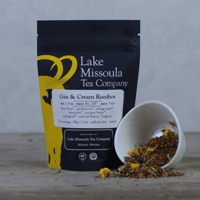 Lake Missoula Tea Company Gin & Cream flavored tea in a tea bag, with dried tea leaves and aroma visible.