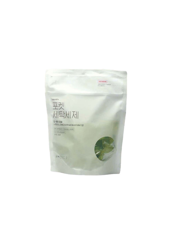 White packaging with green leaf design on a white background