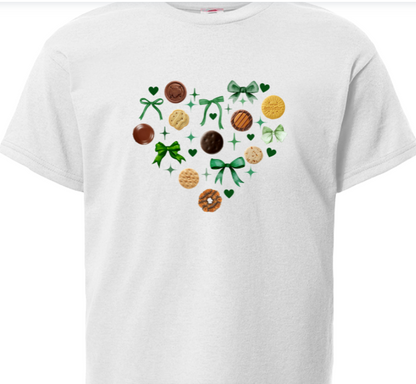 White t-shirt with a heart design featuring girl scout cookies and bows on a white background