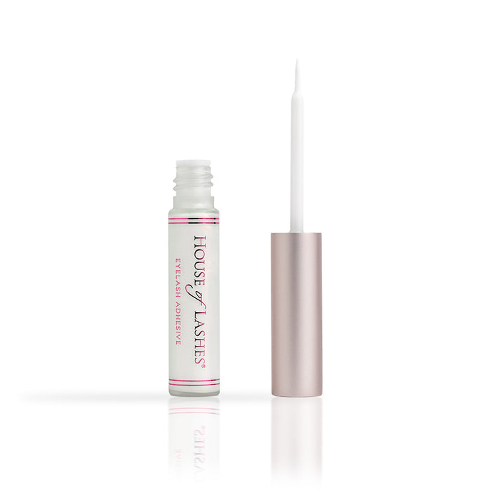 HOL® CLEAR Lash Glue bottle and applicator on a white background.