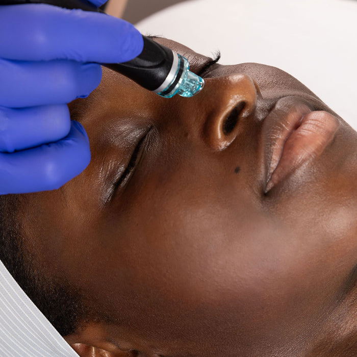 Woman laying down getting a Hydrafacial done