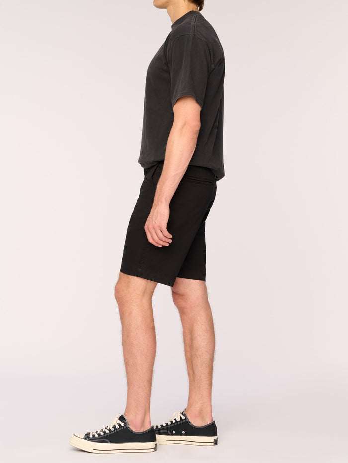DL1961 men's Jake chino short in black, side view on model with charcoal tee.