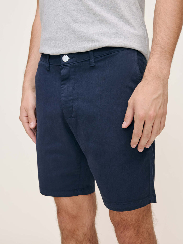 DL1961 men's Jake chino shorts in navy 'Classic Navy', front waist close-up.