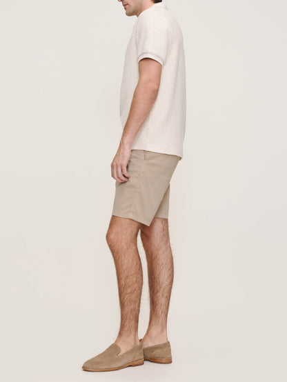 DL1961 men's Jake chino shorts in tan 'Soft Beige', side view on model.