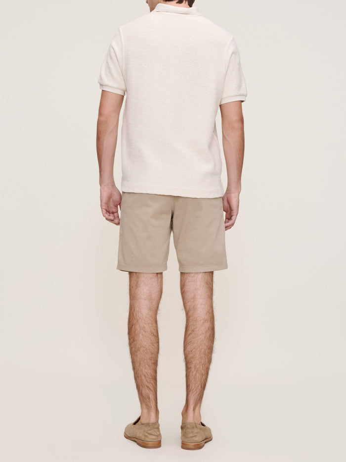 DL1961 men's Jake chino shorts in tan 'Soft Beige', back view on model.