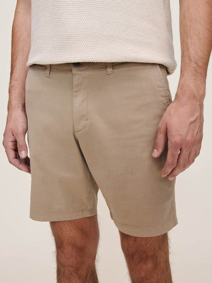 DL1961 men's Jake chino shorts in tan 'Soft Beige', close-up front detail on model.
