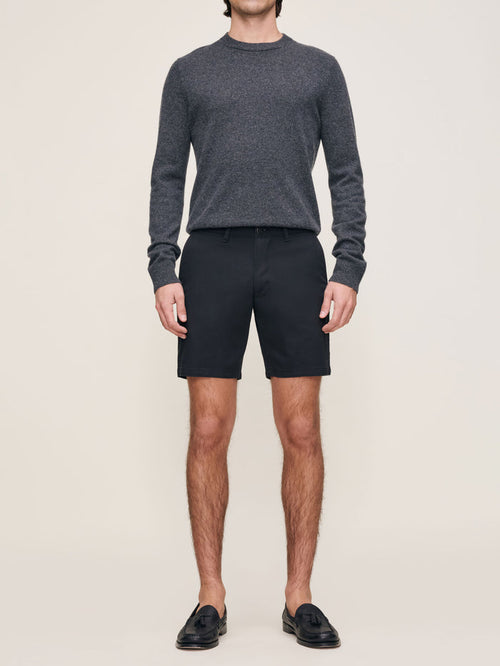 DL1961 men's Jake Dynamic short in black 'Black Onyx', full front view on model with grey sweater.