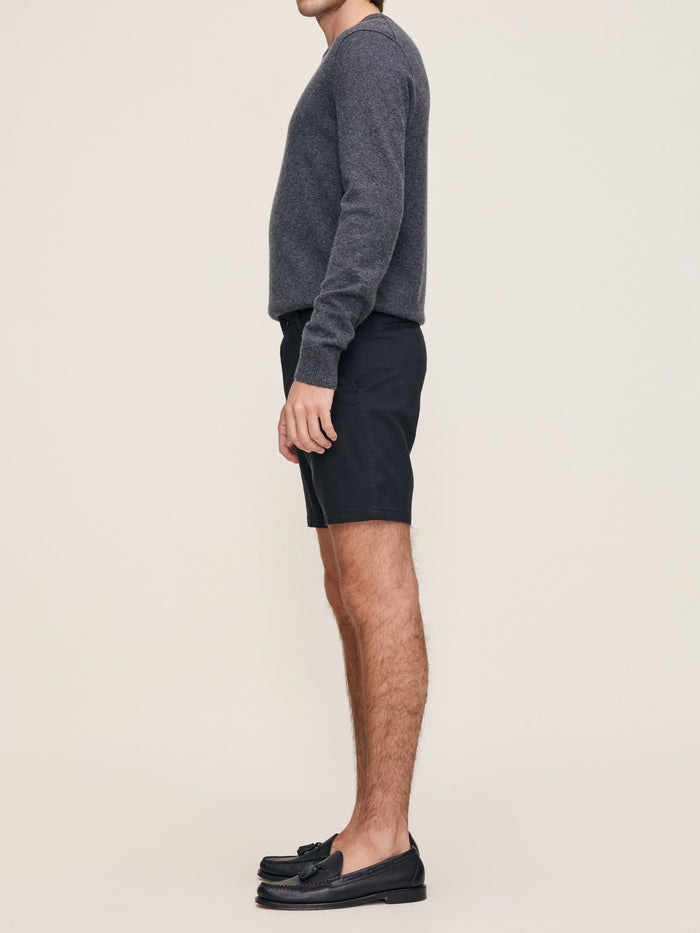 DL1961 men's Jake Dynamic short in black 'Black Onyx', side view on model with loafers.
