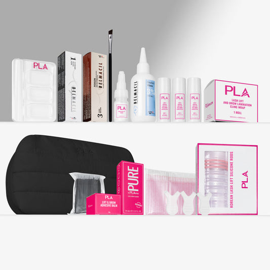 A lash lift kit arranged on a light gray background, including multiple boxed and bottle products labeled PLA, a black puff pouch bag, clear mixing tray, pink and white packaging, and lift and brow adhesive. No person, animal, or real environment is present, so this is Product/Packaging.