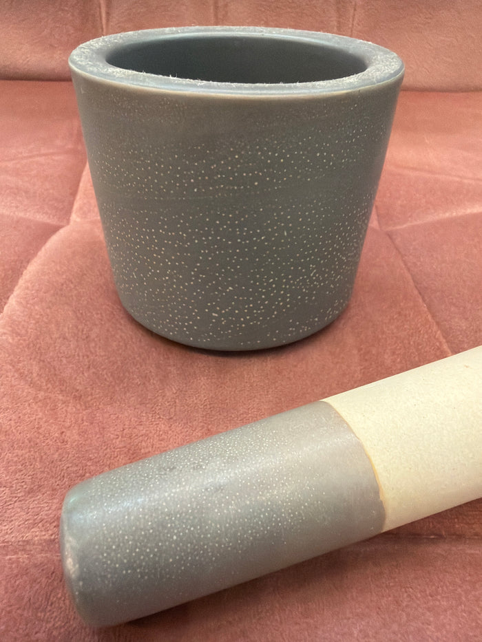 Large A Sparkling Mess mortar and pestle dish with a textured stone surface and rounded shape for grinding and mixing.