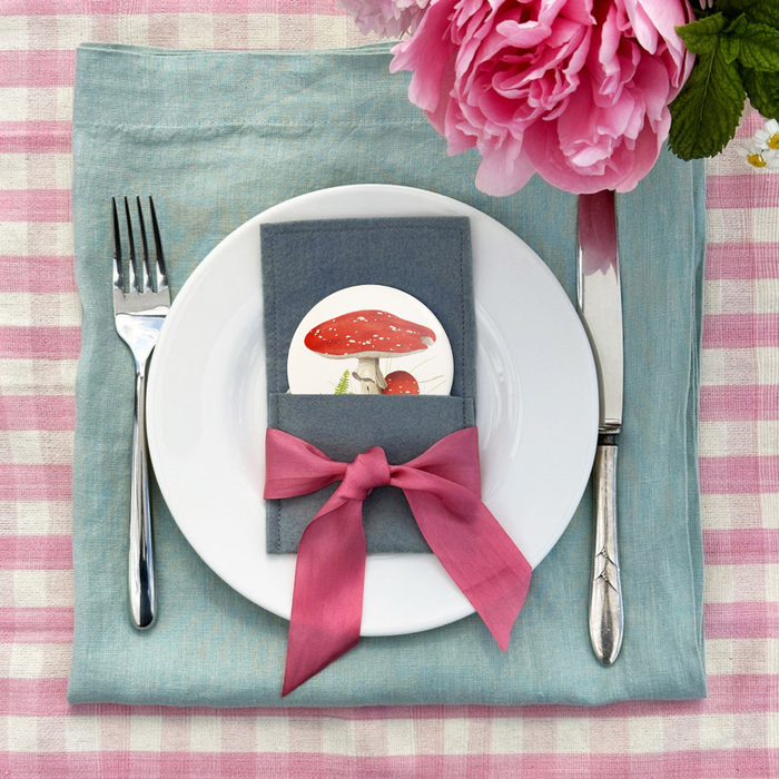 Pocket mirror in dark blue wool-felt pouch with pink ribbon bow and mushroom artwork