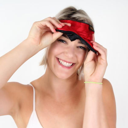 Lady Peaking out from under red silk sleep mask